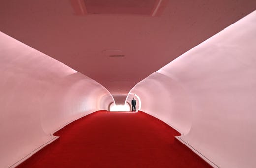 A security guard stands in the Hughes Wing after the ribbon cutting ceremony to officially open the TWA Hotel at JFK International Airport in New York, May 15, 2019. The former 1962 TWA Flight Center designed by the architect Eero Saarinen opened in 1962 and closed in 2001. The new hotel will have 512 mid-century-furnished rooms, an infinity pool and lounge on the roof. 