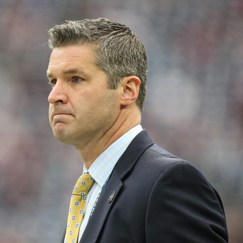 Houston Texans general manager Brian Gaine looks...
