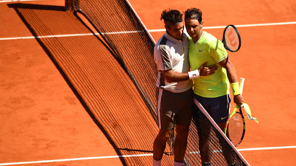 June 7: Rafael Nadal and Roger Federer embrace at the net after Nadal defeated Federer in straight sets to advance to the final.