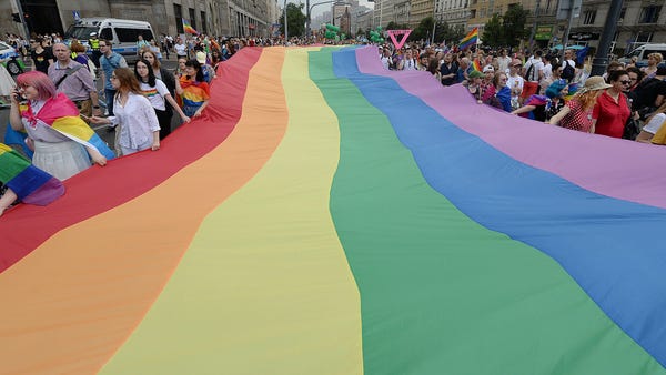 People take part in a gay pride parade in Warsaw,...