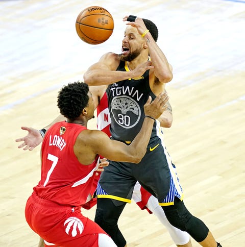 Warriors guard Stephen Curry loses the ball...