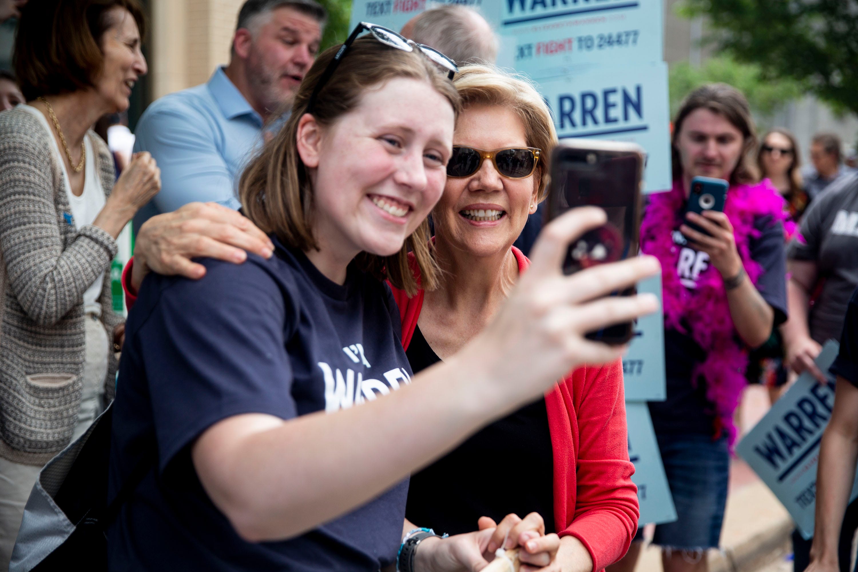 Isabelle Webber, of Marion, poses for a selfie with Elizabeth Warren, candidate for president, outside of the Iowa Democratic Party's hall of fame event on Sunday, June 9, 2019, in Cedar Rapids. 