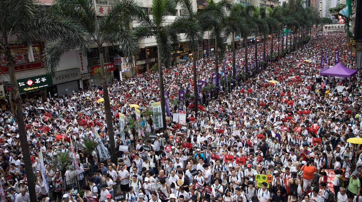 Protesters take part in a march against amendments to an extradition bill in Hong Kong, China, June 9, 2019.