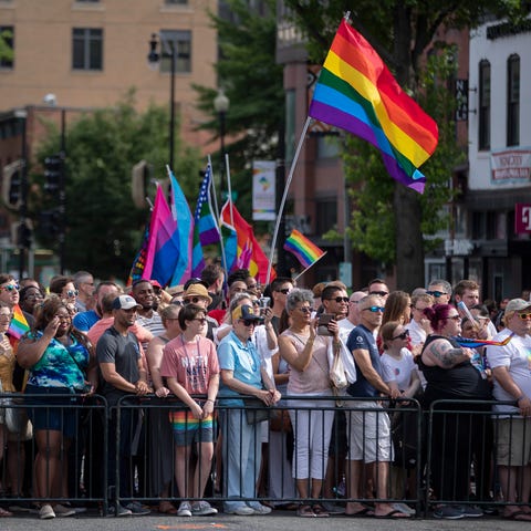 People watch the DC Pride Parade in Washington,...