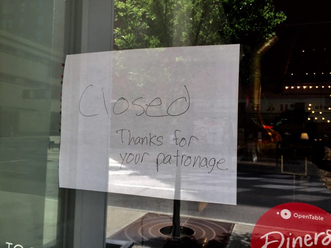 A sign on the window of MidiCi, Downtown.