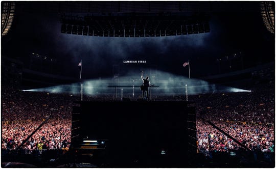 Paul McCartney looks out at a sold-out crowd at Lambeau Field from atop a raised platform on the stage of his Freshen Up Tour on June 8.