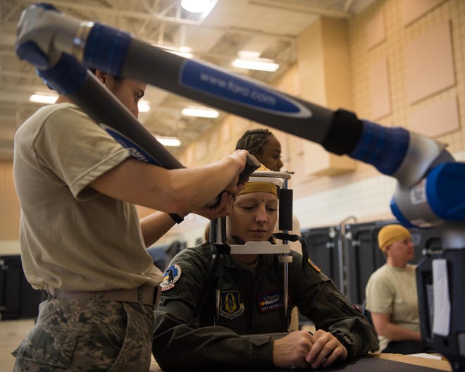 An Airman gets her head measured at the Female Fitment Event at Joint Base Langley-Eustis, Va., June, 4, 2019. The purpose of the event was to take the measurements of female aviators to use when designing female flight equipment prototypes.
