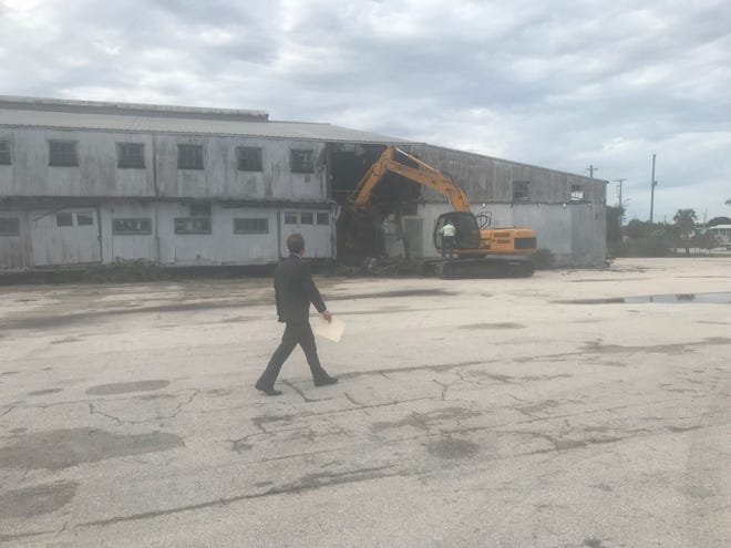 St. Lucie County Seaport Director Stan Payne on June 10, 2019 walks by former citrus packinghouse at the Port of Fort Pierce. The building is being demolished to make way for development of Derecktor Ft. Pierce, a mega-yacht refit center at the port.
