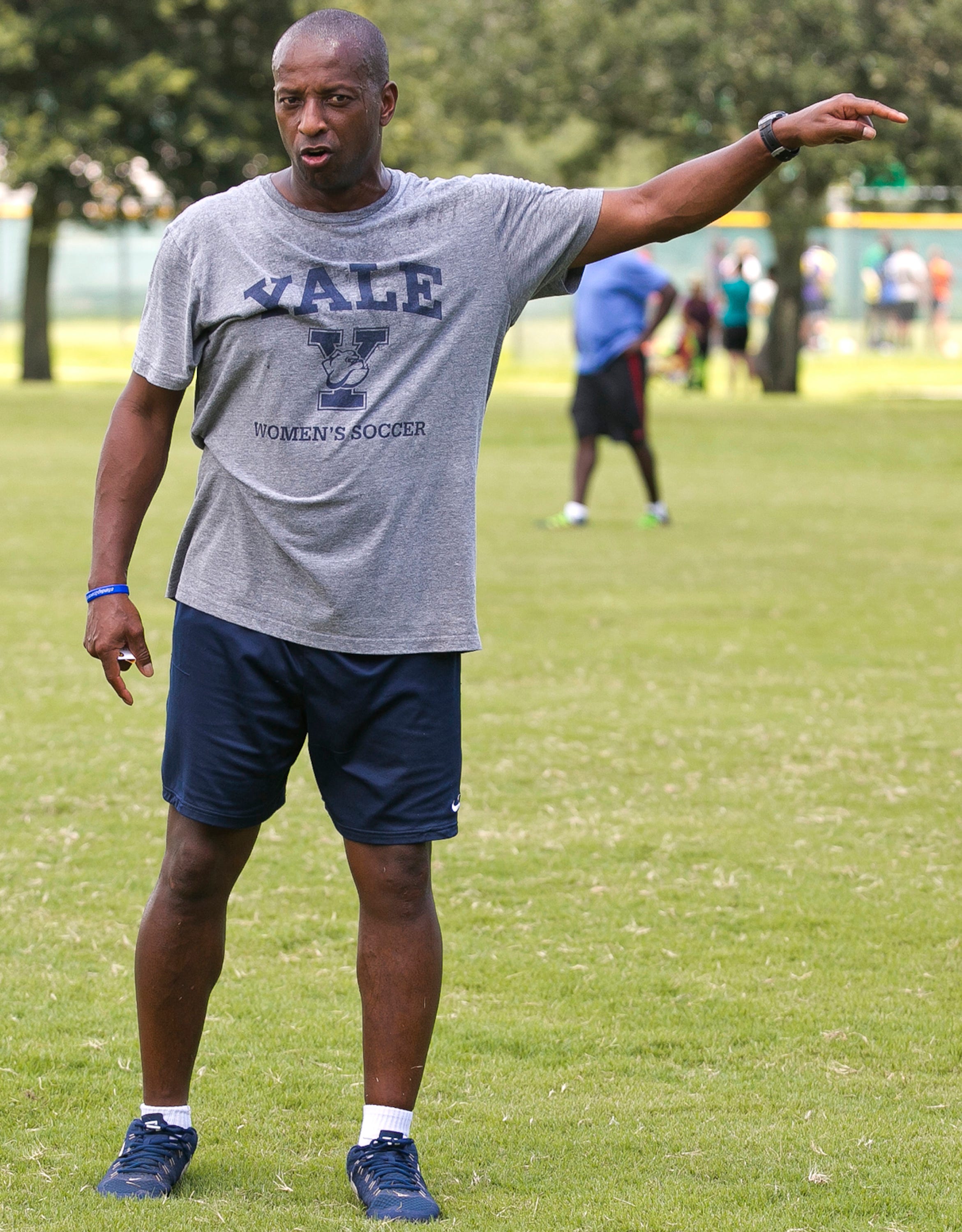 In a September 2016 photo, Yale's women's head soccer Coach Rudy Meredith gives pointers to players during a scrimmage in Ocala, Florida. Meredith put a perspective student who didn’t play soccer on a school list of recruits, doctored her supporting portfolio to indicate she was a player, and later accepted $400,000 from Rick Singer. He's pleaded guilty in the scam.