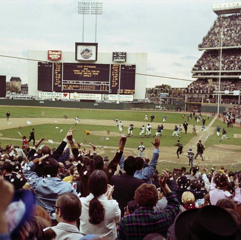 Mets players run on to the field at Shea Stadium...