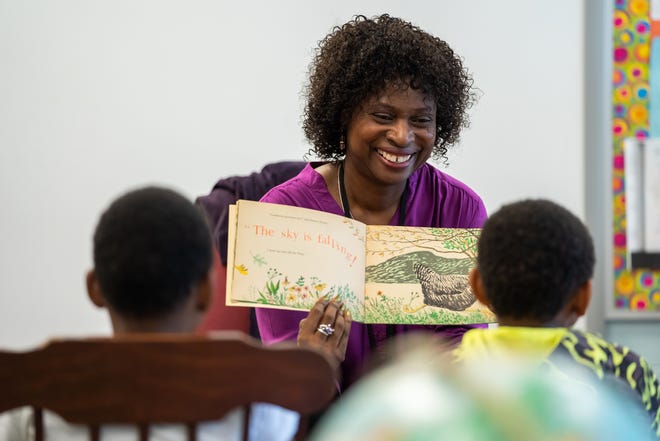 Forest Park Elementary School teacher Melinda Jackson reads to a group of second graders in the resource room at the school in Eastpointe on Monday, June 10, 2019.