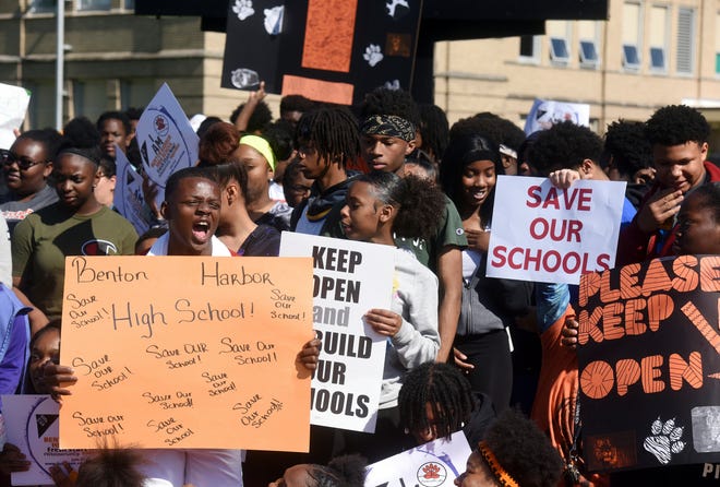 Benton Harbor High School students gather in front of the high school in Benton Harbor, Mich., Tuesday, June 11, 2019, during an annual Peace Walk held at the end of the school year.