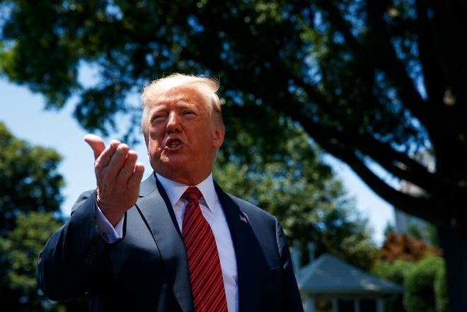 President Donald Trump speaks to reporters before departing for a trip to Iowa, on the South Lawn of White House, Tuesday, June 11, 2019, in Washington.