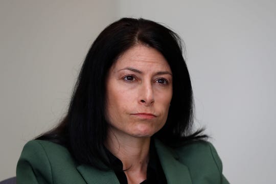 In this June 4, 2019, photo, Dana Nessel, Attorney General of Michigan, listens to a question from reporters in Detroit.