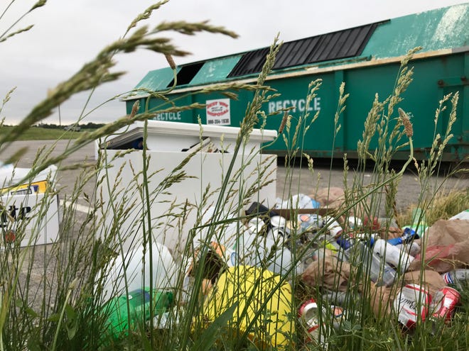 Recycling and trash piles up near a recycling bin at Southwestern Middle School on Tippecanoe County Road 800 South on Monday, June 10, 2019. Drop-off recycling sites in rural Tippecanoe County have been under more pressure  in the past month since West Lafayette closed a drop-off center in May.