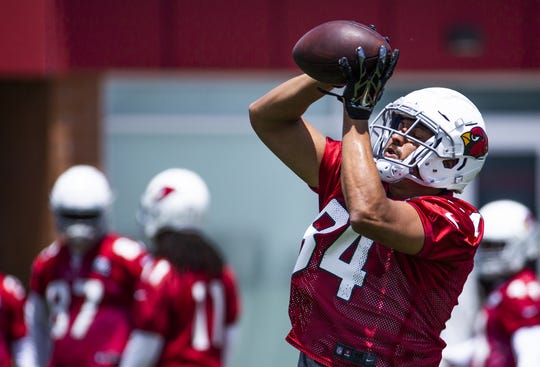 Arizona Cardinals tight end Caleb Wilson catches a pass during practice at the Dignity Health Arizona Cardinals Training Center in Tempe, Tuesday, June 11, 2019.