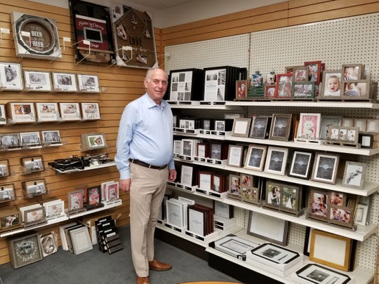 Richard Master, CEO of MCS Industries in Easton, Pa. stands in a showroom of the company's picture frames and wall decor. He says one of the biggest impediments to keeping labor costs in line, has been the increasing expense of health coverage in the United States.
