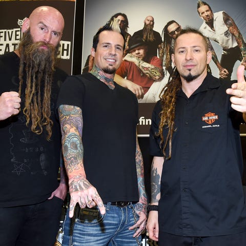 Bassist Chris Kael, drummer Jeremy Spencer, and...