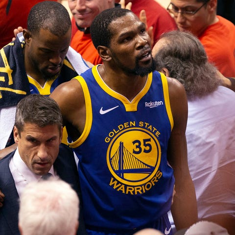 Kevin Durant heads to the locker room after...