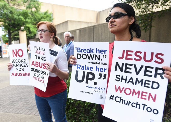 Jennifer Weed, left, and Nisha Virani demonstrated outside the Southern Baptist Convention's 2019 meeting in Birmingham, Ala. to urge leaders to combat sexual abuse within the church.