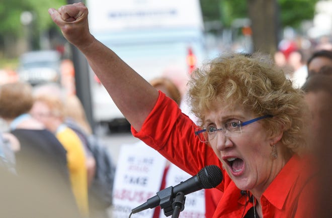 Christa Brown, of Denver, Colo., speaks outside the Southern Baptist Convention's annual meeting Tuesday, June 11, 2019, during a rally in Birmingham, Ala. (AP Photo/Julie Bennett)