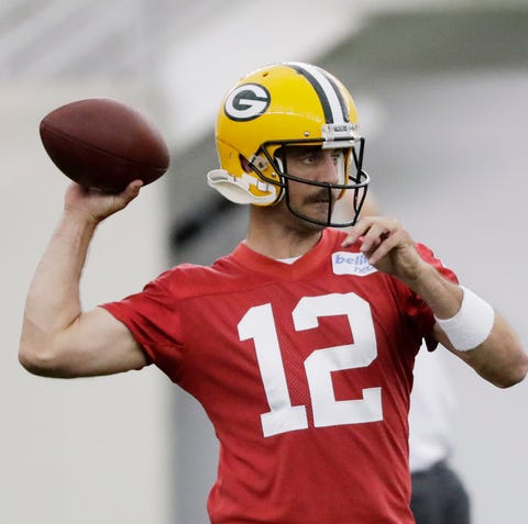 Green Bay Packers quarterback Aaron Rodgers (12)...