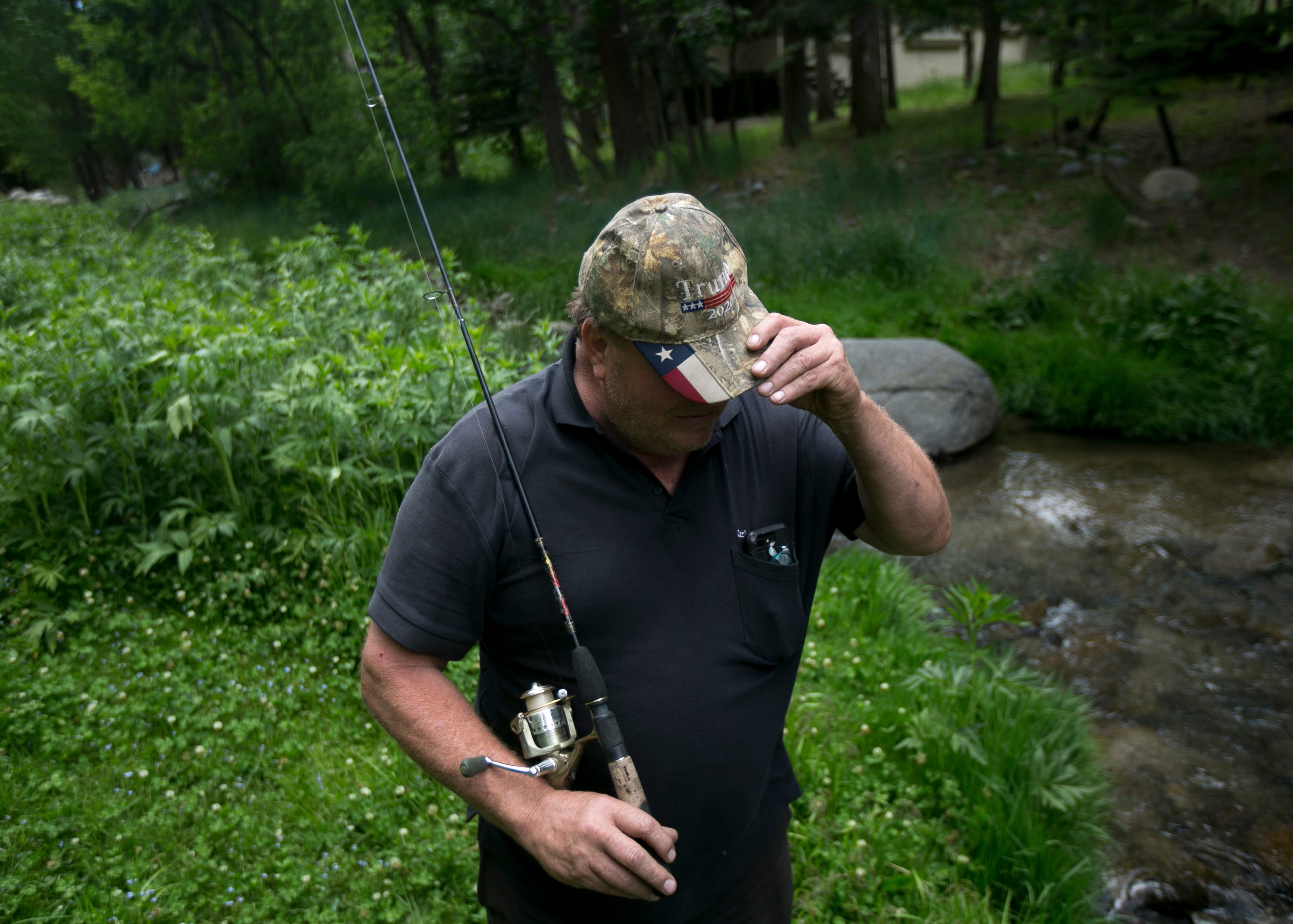 Jim Carlen, a tourist from Lubbock, Texas, fishes a creek in Ruidoso, New Mexico, on June 1, 2019. Carlen has been visiting for nearly 30 years.