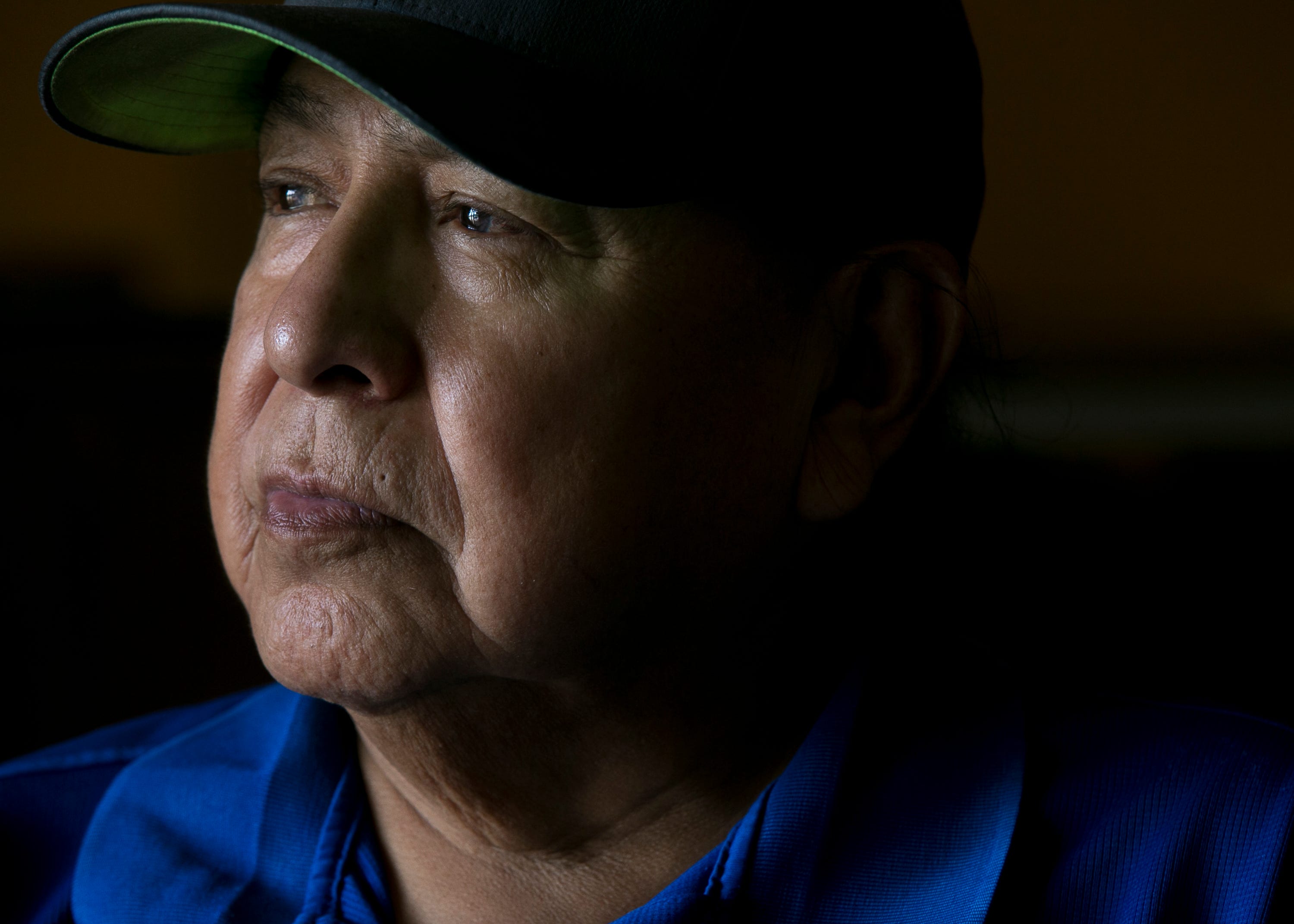 Freddie Kaydahzinne, a Mescalero Apache medicine man and director of the tribal museum, sits for a portrait in Mescalero, New Mexico, on May 30, 2019. 