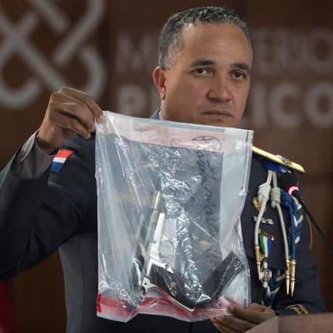 Police director Ney Aldrin Bautista shows the gun...
