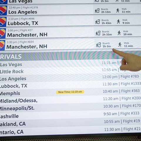 Passengers interact with new flight information...