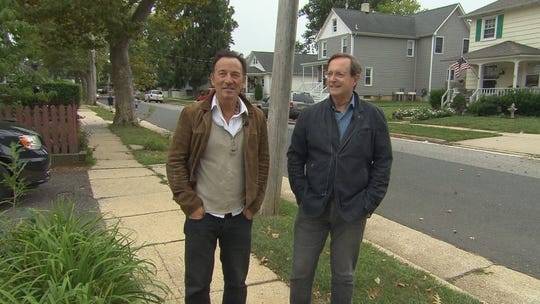 Bruce Springsteen and Anthony Mason on Randolph Street in Freehold Borough during the taping of a CBS Sunday Morning segment featuring The Boss.