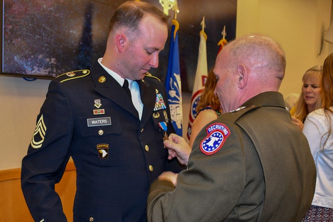 Gregory Waters receives the Distinguished Service Cross in a ceremony June 5. The award is is the second highest military medal a soldier can receive, just below the Medal of Honor.