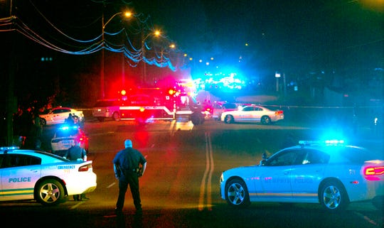 Memphis police officers stand near the scene of a police shooting in Frayser on June 12, 2019. Brandon Webber was killed by U.S. marshals in the shooting.