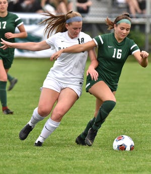 Wildcat Jessica Bandyk, right, and Forest Hills Central midfielder Gwen Henderson both go after the ball on June 12 during their state Div. 1 semi-final.