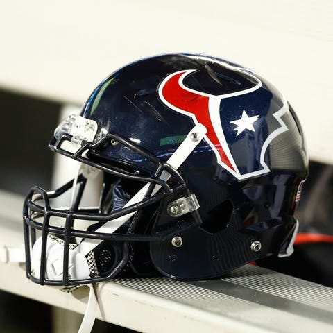 Texans helmet lays on the bench during the game.