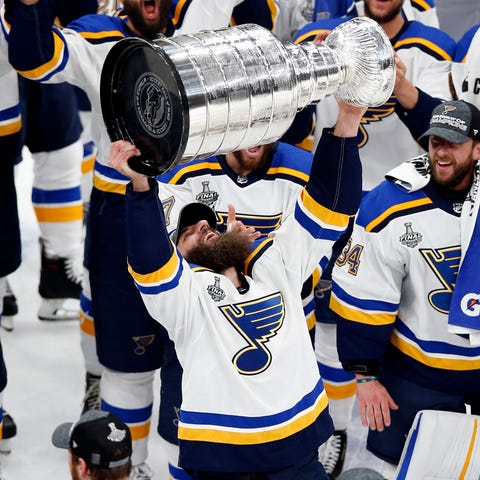 Chris Thorburn hoists the Stanley Cup.