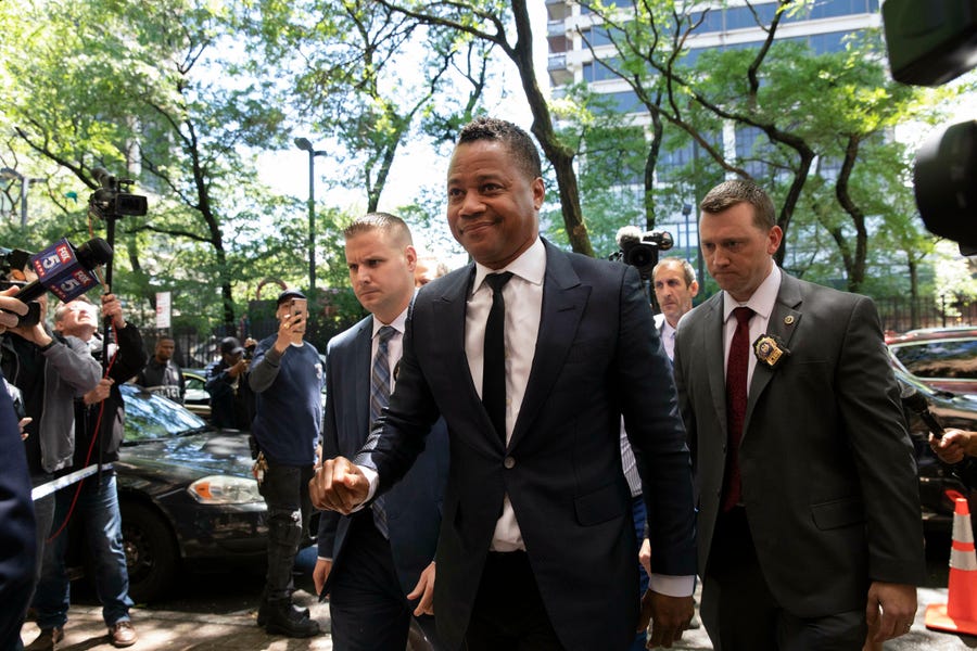 Cuba Gooding Jr. arrives at the New York Police Department's Special Victim's Unit on June 13 to face an allegation he groped a woman at a bar in Manhattan.