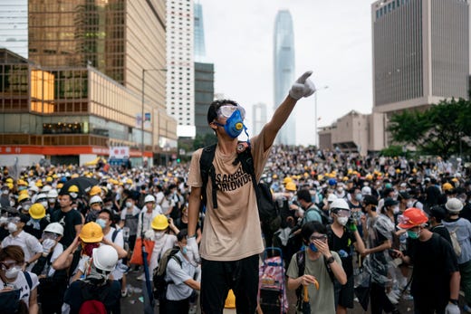 HONG KONG, HONG KONG - JUNE 12: A protester makes a gesture during a protest on June 12, 2019 in Hong Kong China. Large crowds of protesters gathered in central Hong Kong as the city braced for another mass rally in a show of strength against the government over a divisive plan to allow extraditions to China. (Photo by Anthony Kwan/Getty Images) *** BESTPIX *** ORG XMIT: 775334385 ORIG FILE ID: 1149495159