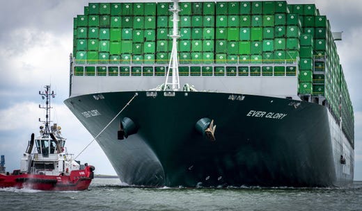 epa07645640 The Ever Glory of Evergreen arrives during her maiden voyage at the Amazonehaven in Rotterdam, the Netherlands, 13 June 2019. The Liberia-flagged 'Ever Glory' is the first ship of the shipping company that is packed with 20,000 so-called TEU containers from Evergreen. EPA-EFE/Jerry Lampen ORG XMIT: 74536146