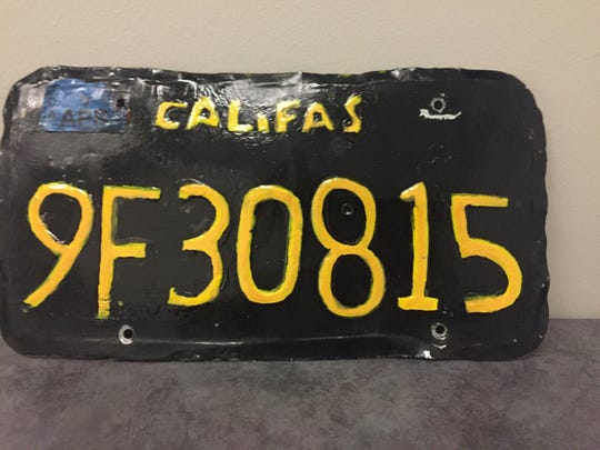 This undated photo provided by the Sheriff County Department of Ventura shows a phony license plate. A big truck driver was arrested after the authorities discovered this phony license plate on his truck.