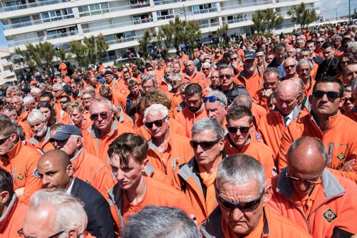 National Society of Sea Rescue (SNSM) ocean rescue volunteers attend a tribute ceremony for the three SNSM volunteers, Yann Chagnolleau, Dimitri Moulic and Alain Guibert, who died in a storm last week after their boat capsized, at Fort-Saint Nicolas in Les Sables d'Olonne, western France, on June 13, 2019. (Photo by LOIC VENANCE / AFP)LOIC VENANCE/AFP/Getty Images ORIG FILE ID: AFP_1HH45F