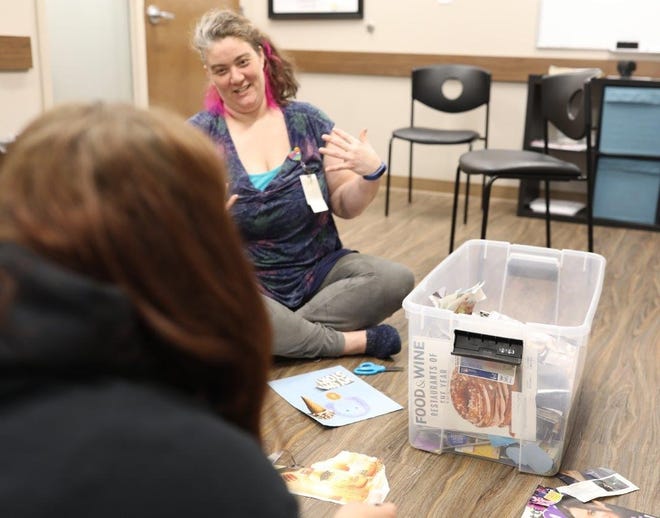 Beth Andriacco, a case manager at BrightView, an outpatient addiction treatment center in Cincinnati, interacts with patients in the Kaleidoscope group on Thursday, June 13, 2019. Andriacco created the therapy group for LGBTQ patients struggling with substance use.