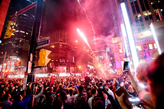 Thousands of fans celebrate in the streets of Toronto after the Raptors defeated the Golden State Warriorrs.