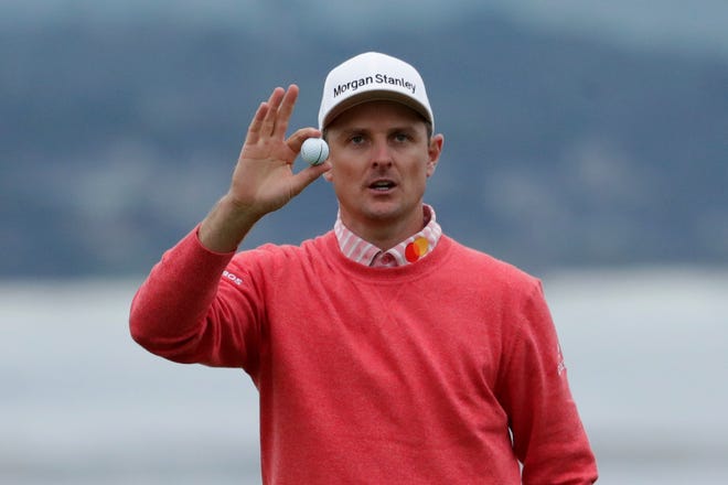 Justin Rose, of England, waves after his first round of the U.S. Open.