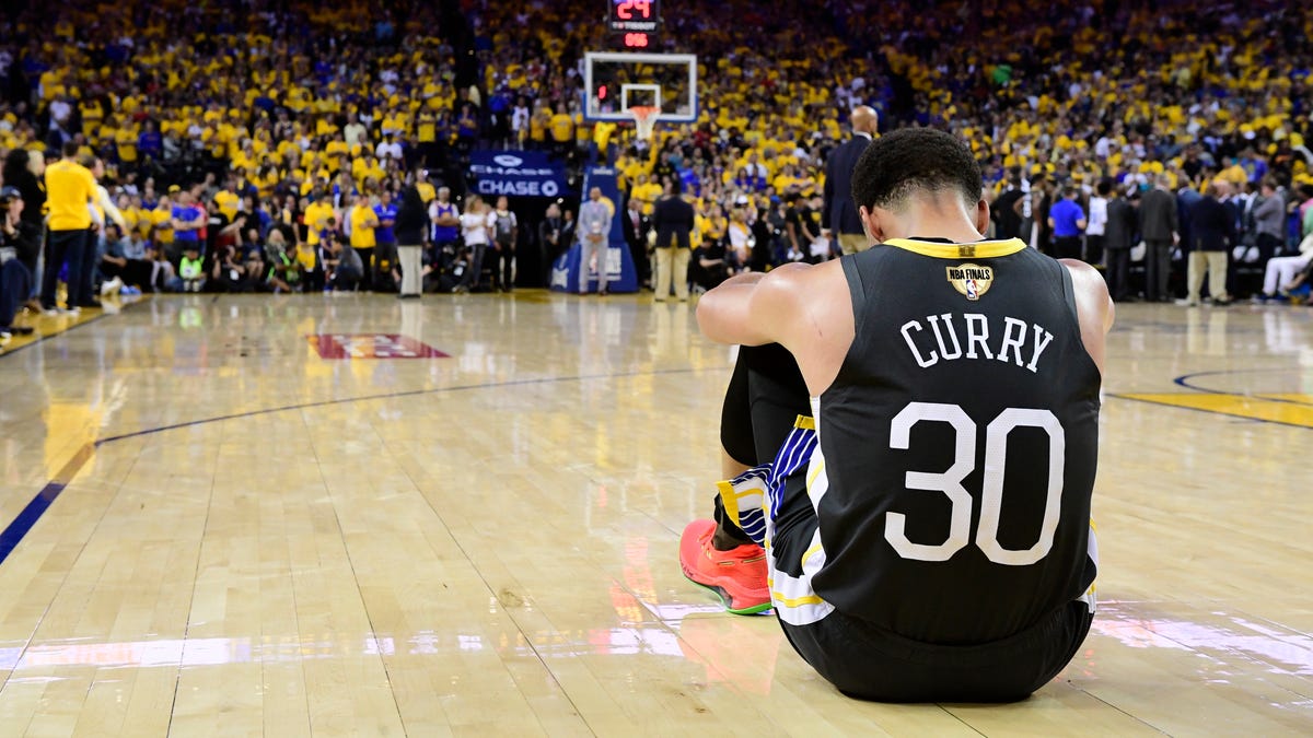 Golden State Warriors guard Stephen Curry reacts after teammate Klay Thompson was injured.