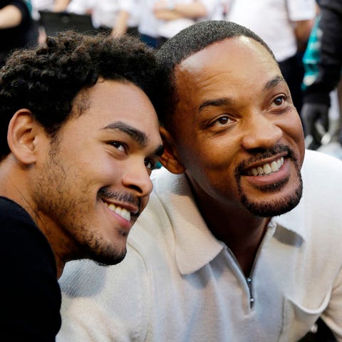Will Smith, right, and his son Trey visit the pit 