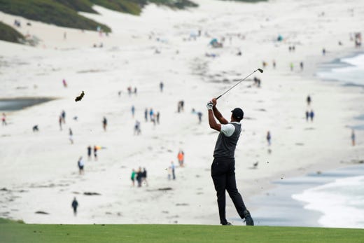 Jun 13, 2019; Pebble Beach, CA, USA; Tiger Woods hits his fairway shot on the ninth fairway during the first round of the 2019 U.S. Open golf tournament at Pebble Beach Golf Links. Mandatory Credit: Michael Madrid-USA TODAY Sports ORG XMIT: USATSI-389819 ORIG FILE ID: 20190613_mam_mm1_2655.JPG