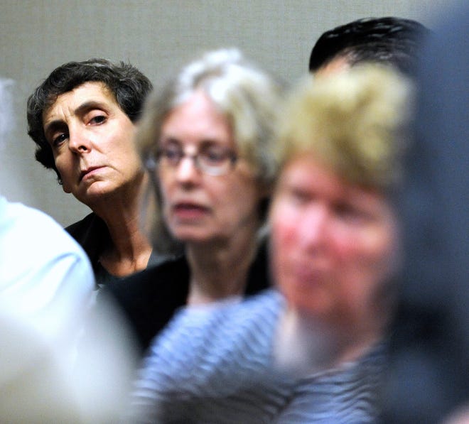 From left, Defendants Liane Shekter-Smith, Corrine Miller, and   Nancy Peeler listen to their defense attorneys. 
Defense attorneys and special prosecutors for six individuals charged in the Flint Water Crisis stand in front of 67th District Court Judge Tracy Collier-Nix during a brief hearing, Tuesday morning, August 9, 2016.