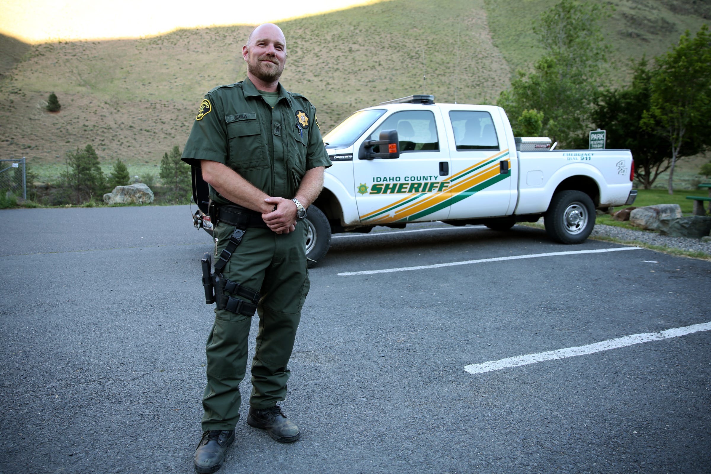 Sgt. Justin Scuka, with the Idaho County Sheriff's Office, speaks on wildfire evacuations plans in Riggins, Idaho on June 11, 2019.