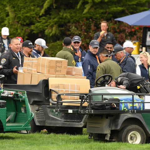 A golf cart loaded with boxes, which was involved...